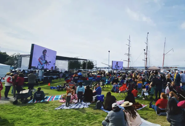 Festival crowd at a waterfront event served by MOBO LED screens