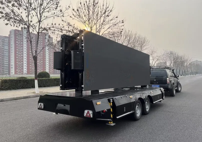 MOBO MB-28 flatbed LED trailer in transport mode with the screen folded for towing