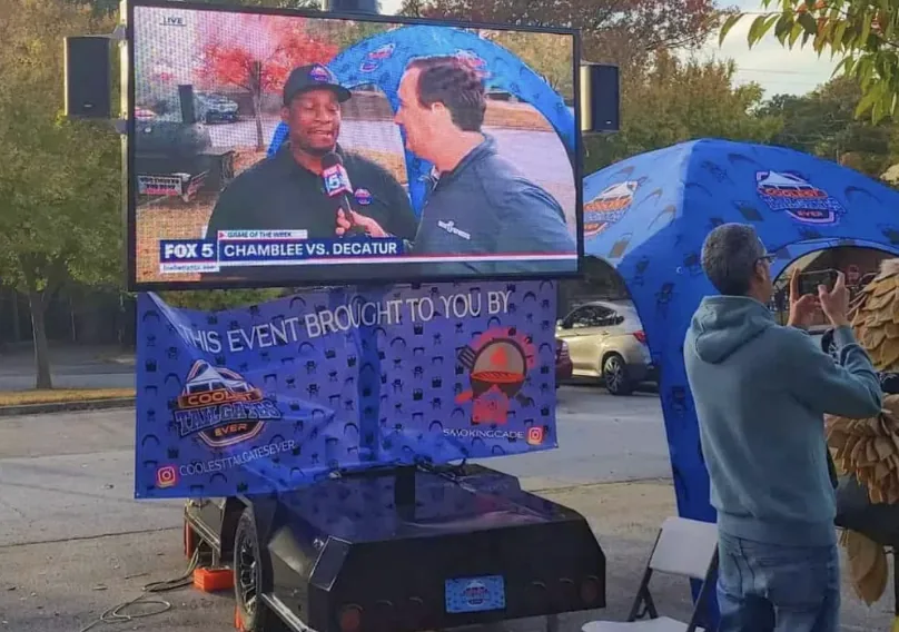 MOBO MB-5 LED trailer showing a live news broadcast at a community event