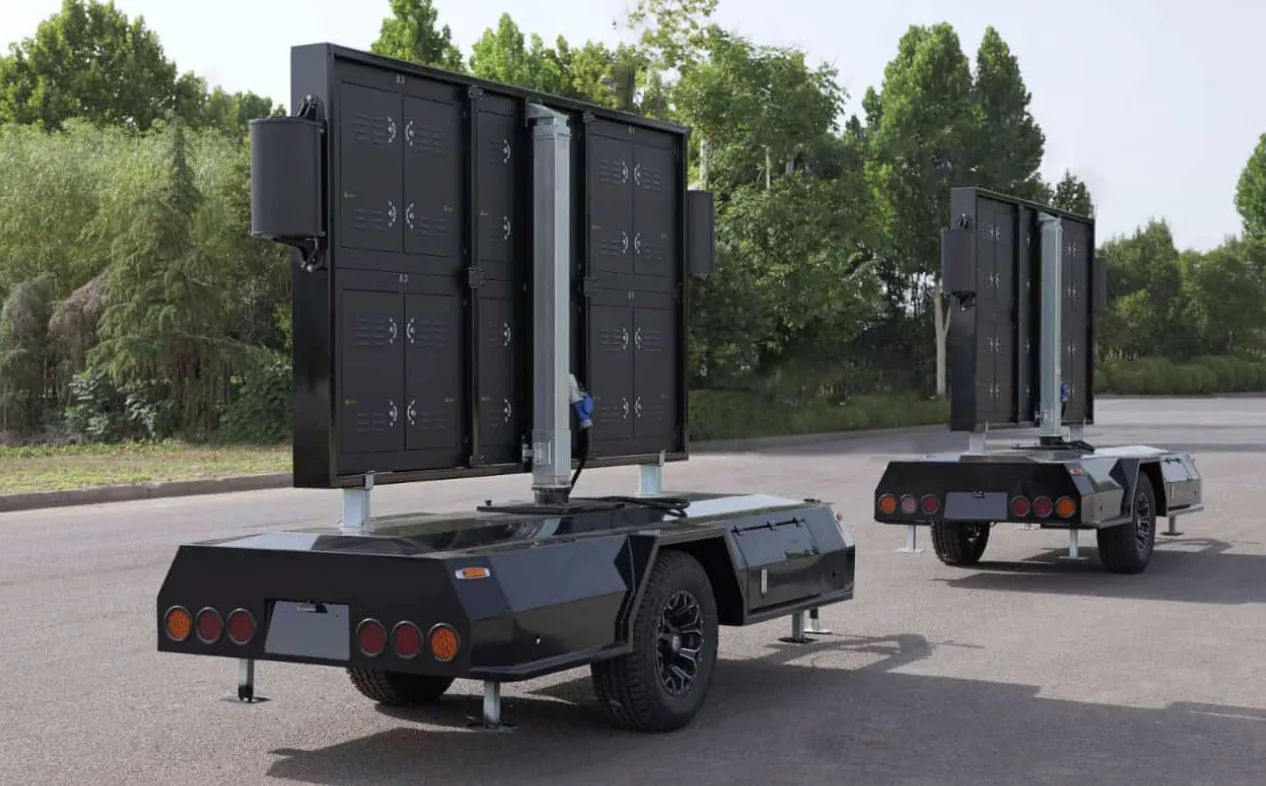 Two MOBO MB-5D double-sided LED trailers staged with screens folded