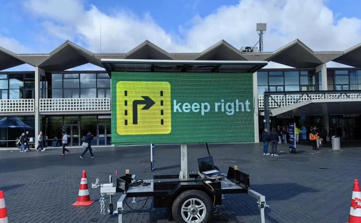 MOBO SAT-3 solar LED trailer directing pedestrian traffic outside a venue