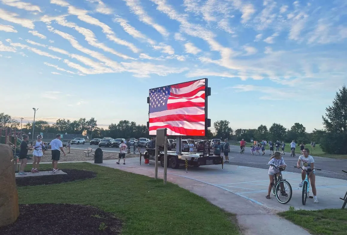 MOBO MB-15 LED screen trailer displaying the American flag for a video production company