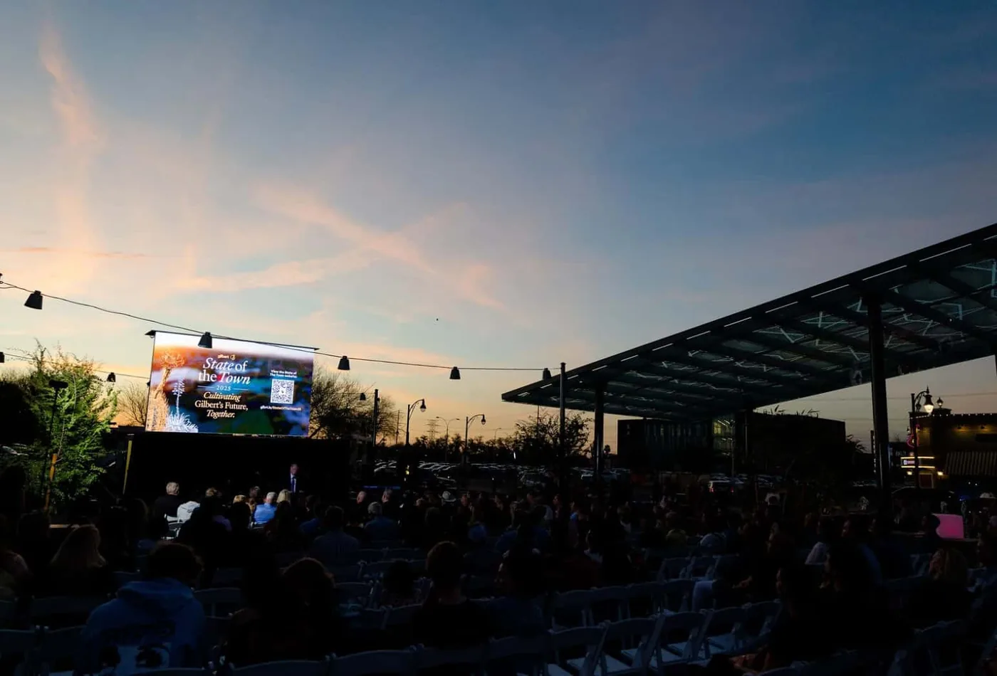 MOBO MB-15E enclosed LED screen trailer at a municipal park event at dusk