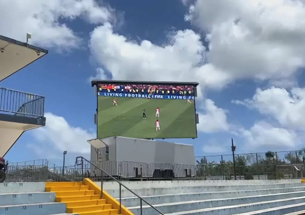 MOBO MB-22E enclosed LED trailer showing live football at an outdoor stadium