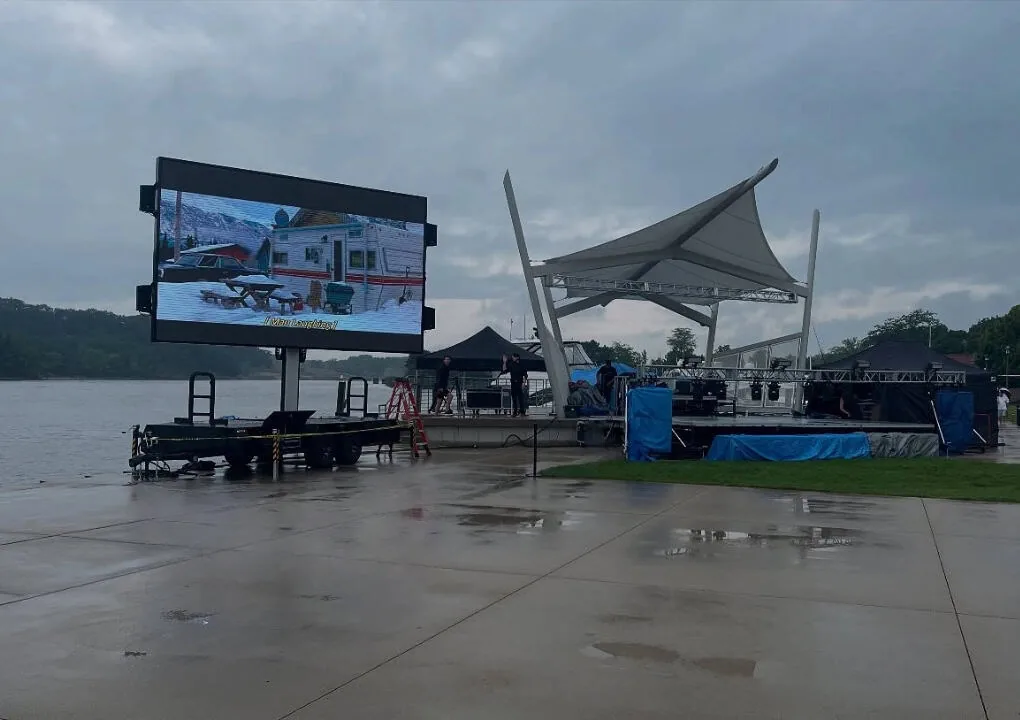 MOBO MB-28 class LED screen trailer operating in the rain at a waterfront event