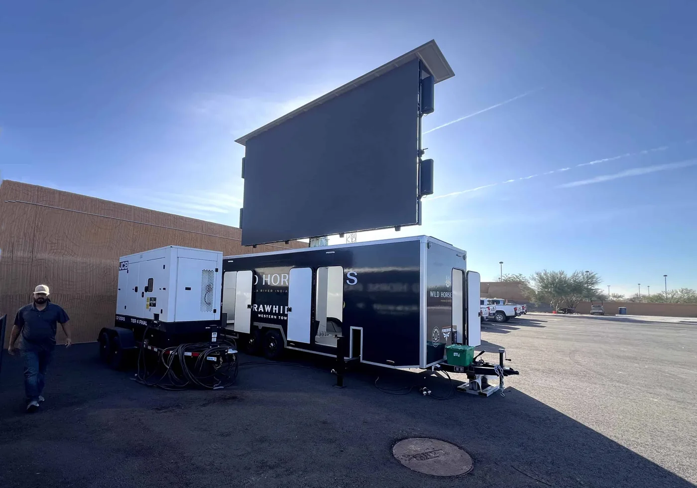 Enclosed MOBO LED trailer at full brightness in direct sunlight, same series as the MB-28E