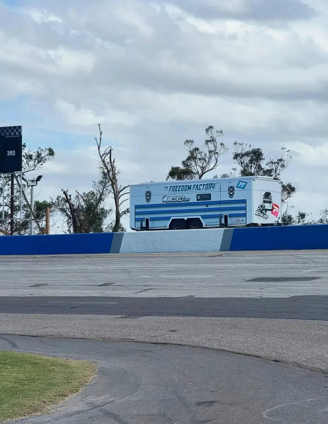Enclosed MOBO LED screen trailer trackside at the Freedom Factory, same series as the MB-28E