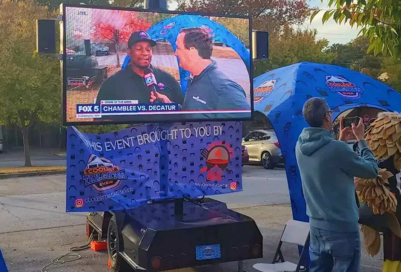 MOBO MB-5 LED screen trailer showing a live local sports broadcast at a community event