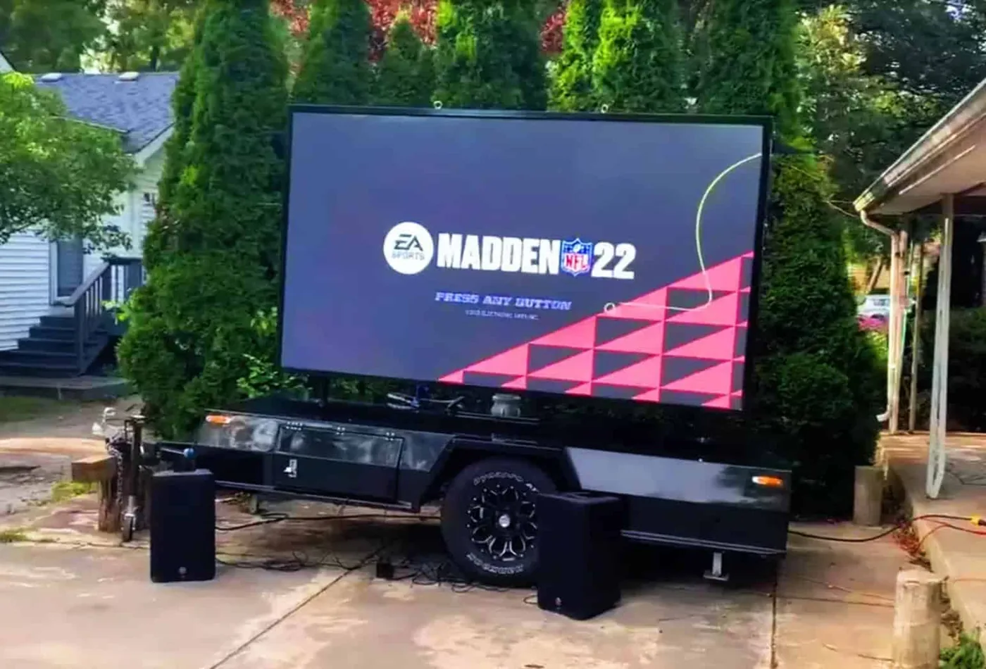 MOBO MB-5 LED screen trailer set up for backyard video gaming on a residential driveway