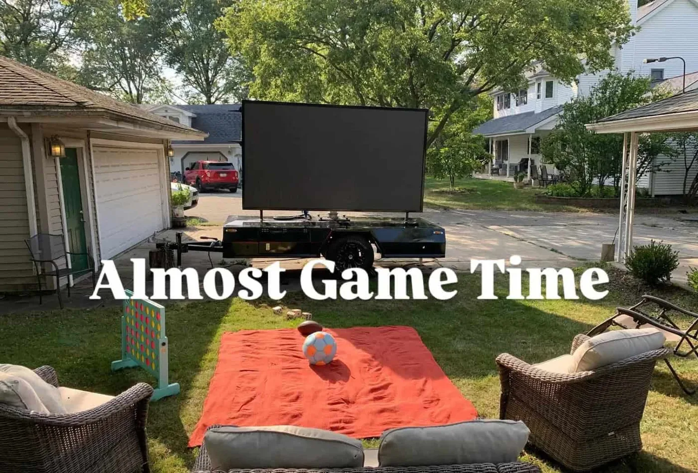 MOBO MB-5 LED screen trailer running game day graphics in an American backyard