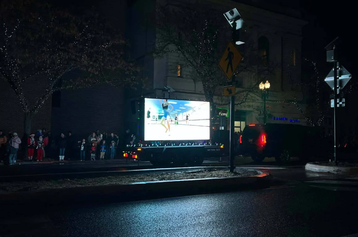 MOBO MB-5D LED screen trailer lit up during a Utah night parade